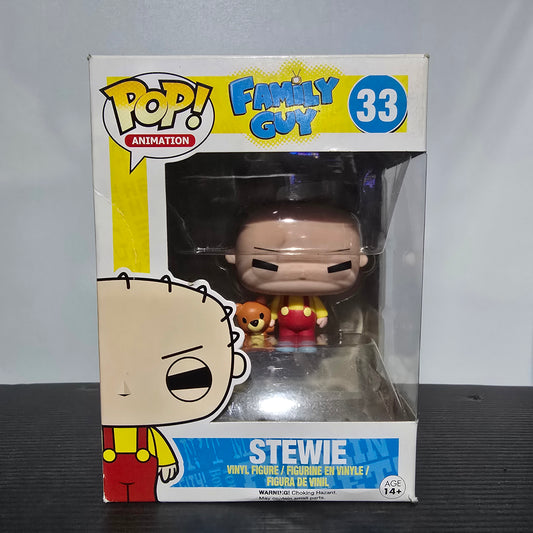 Funko Pop! Vinyl Figure of Stewie Griffin from the animated TV show Family Guy, specifically the #33 figure featuring Stewie with his teddy bear, Rupert.