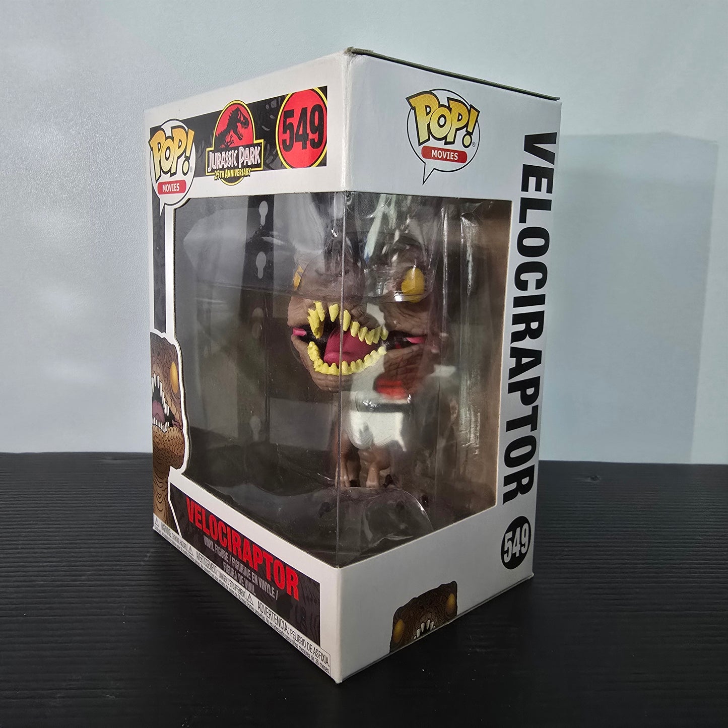 Funko Pop! Movies: Jurassic Park - Velociraptor vinyl figure, specifically number 549 from the 25th Anniversary collection.