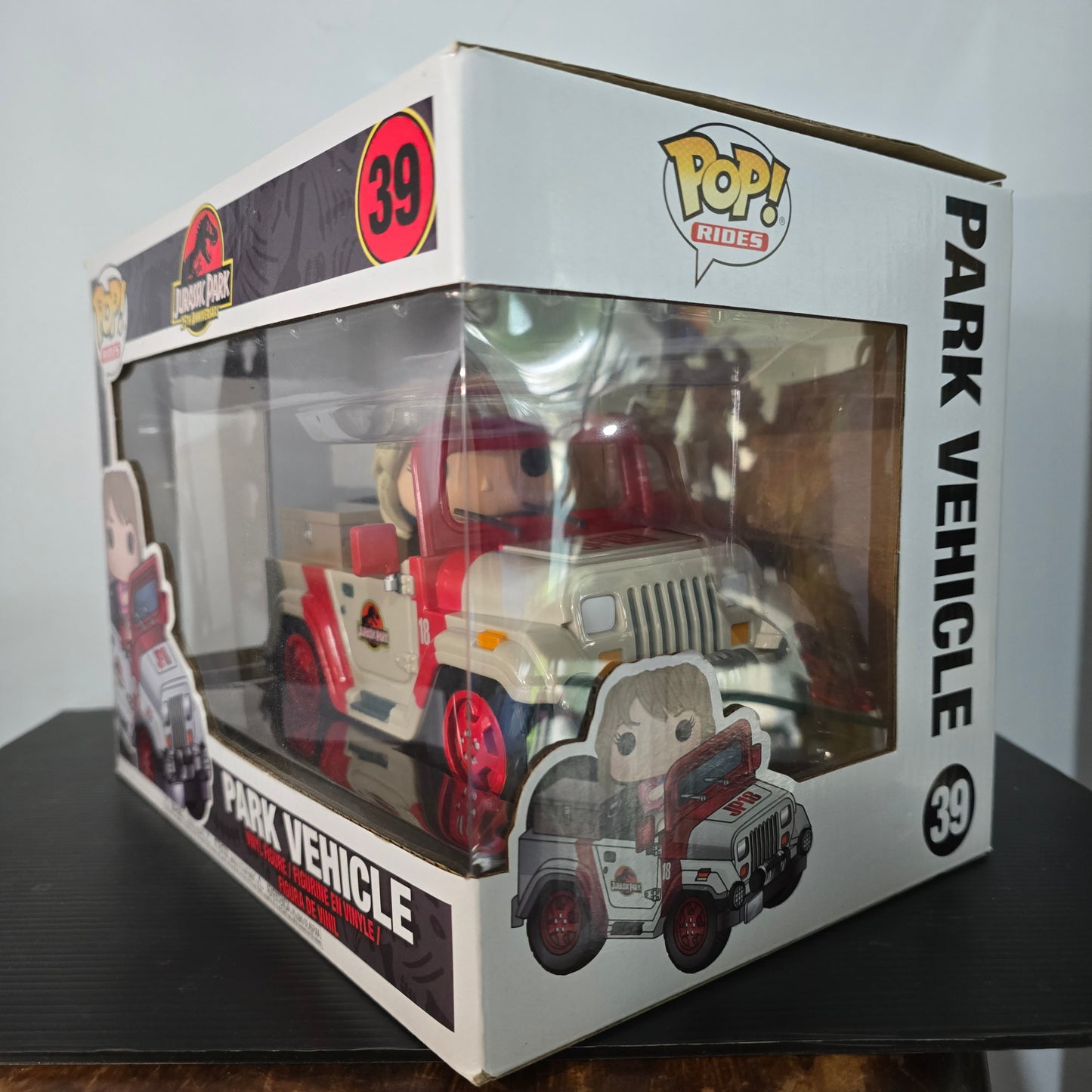 Funko Pop! Rides #39 featuring Ellie Sattler in the Jurassic Park Park Vehicle.
