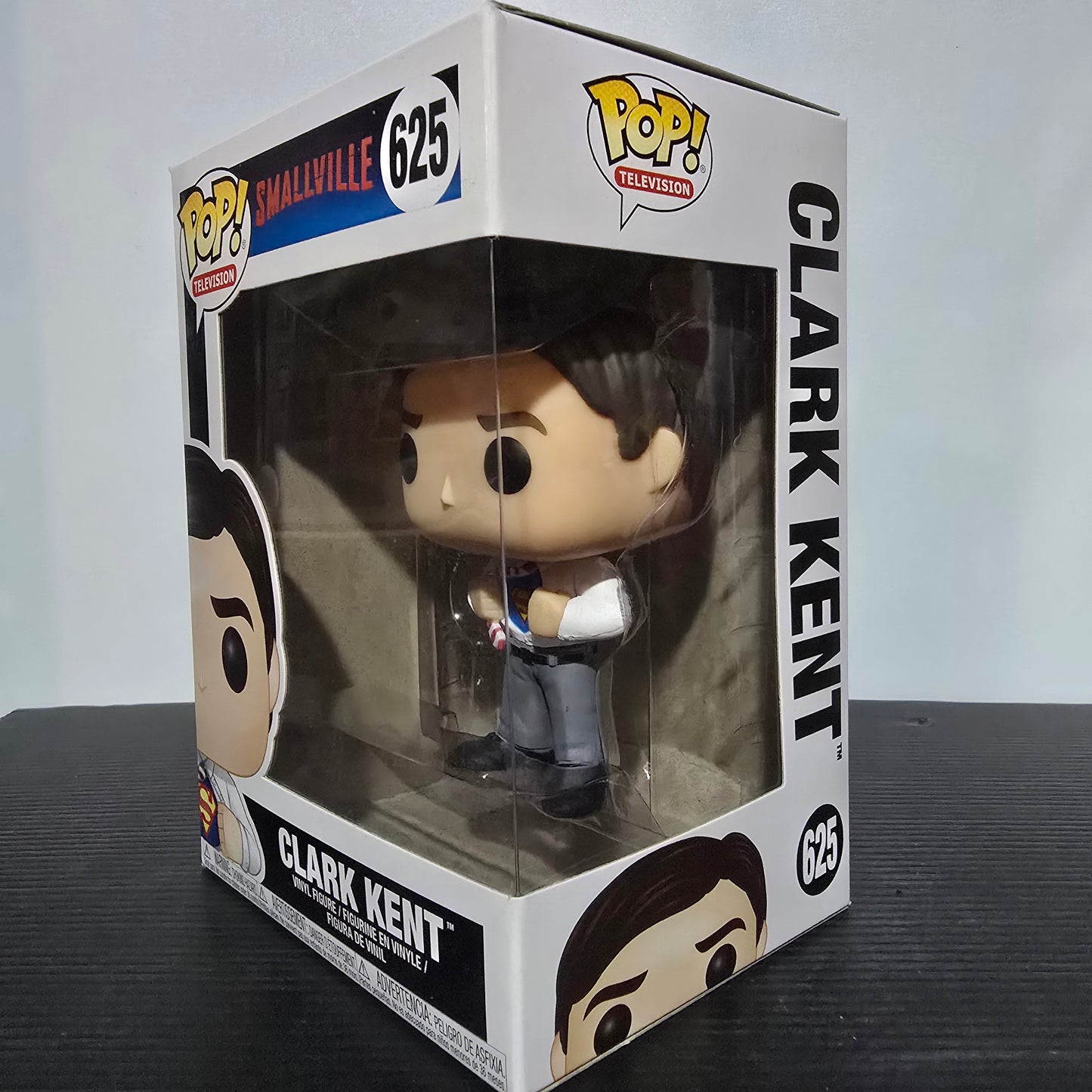 Funko Pop! Television vinyl figure of Clark Kent from the TV series Smallville, specifically number 625 in the Pop! Television series.