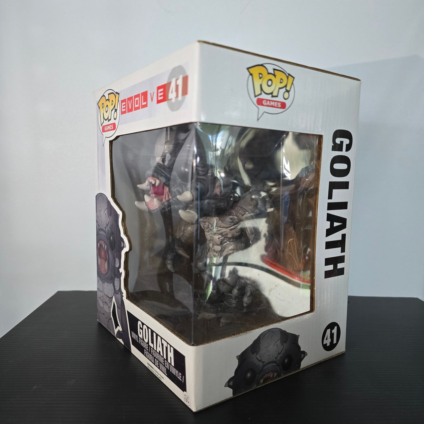 Funko Pop! Games: Evolve Goliath 6" Vinyl Figure, specifically the Glow-in-the-Dark Hot Topic Exclusive version, number 41 in the Pop! Games series.