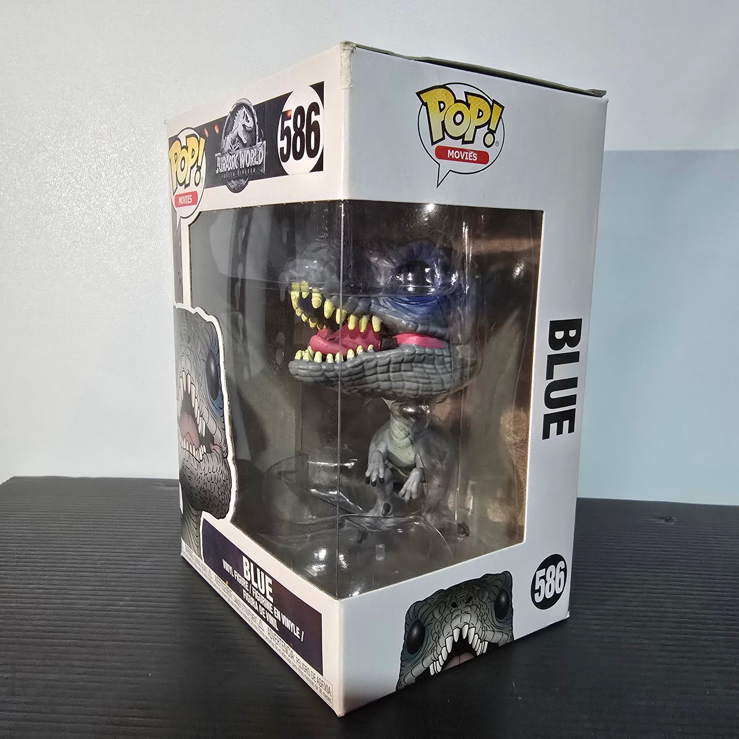 Funko Pop! Movies figure of Blue, the Velociraptor from the film Jurassic World: Fallen Kingdom.