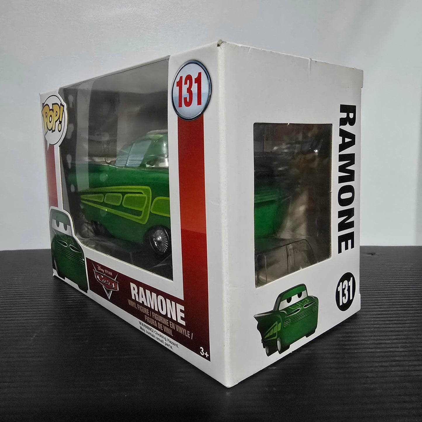 Funko Pop! vinyl figure of Ramone from Disney Pixar's Cars movie, specifically the #131 green paint variant.